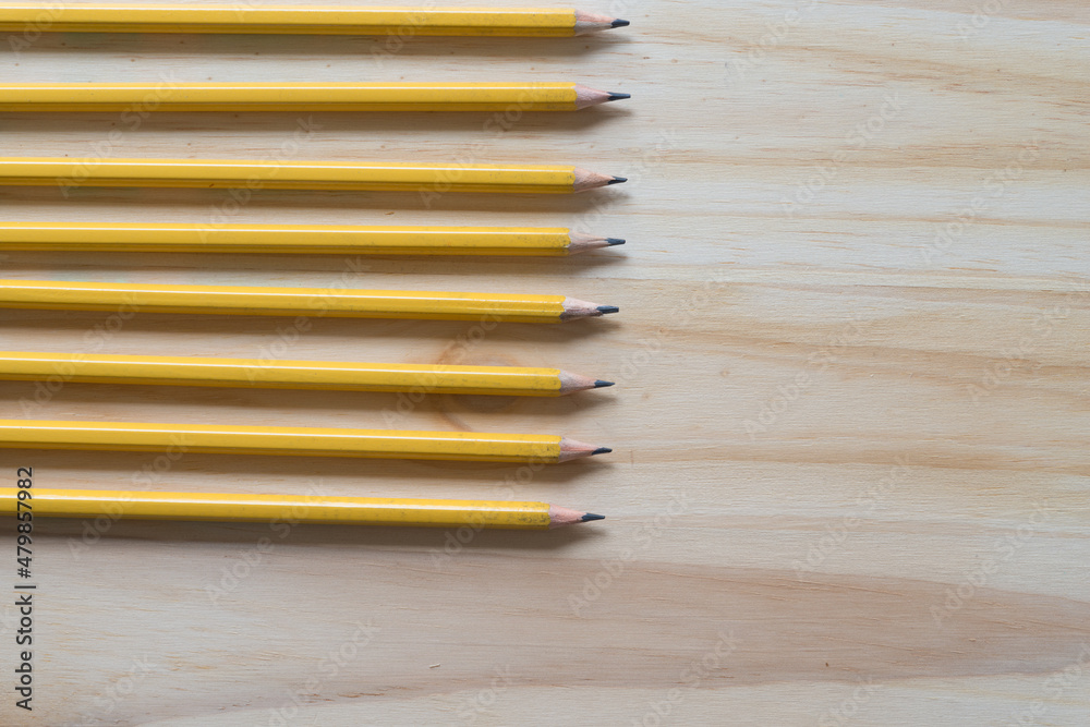 Fototapeta premium pencils on a wooden surface