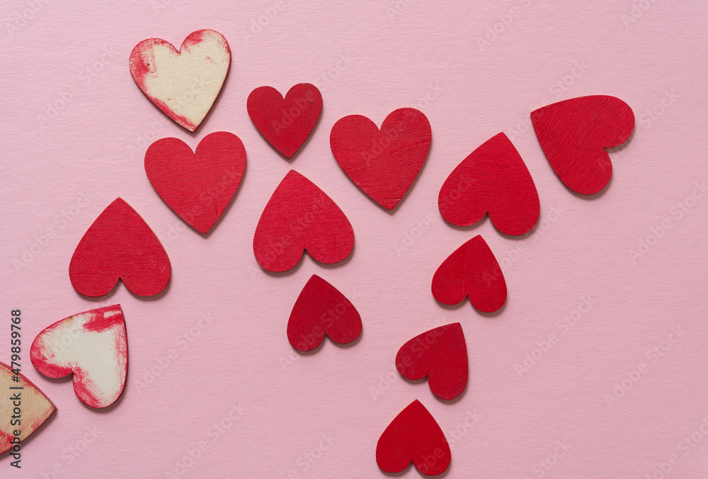 stained, grungy wooden hearts on pink