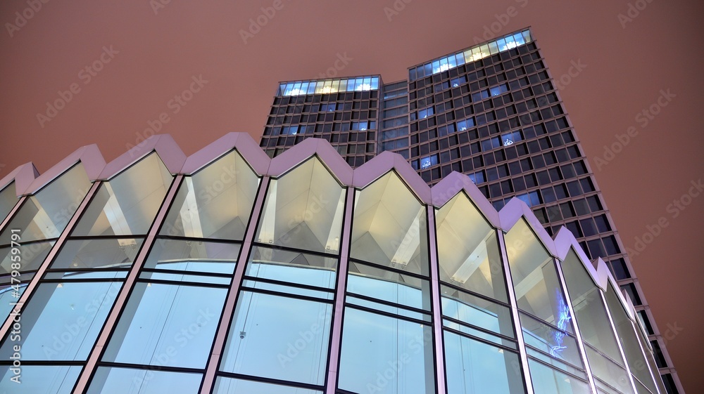 Office building at night, building facade with glass and lights. View with illuminated modern skyscraper. - obrazy, fototapety, plakaty 