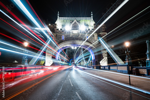 Tower Bridge with evening traffic lights in London. England 