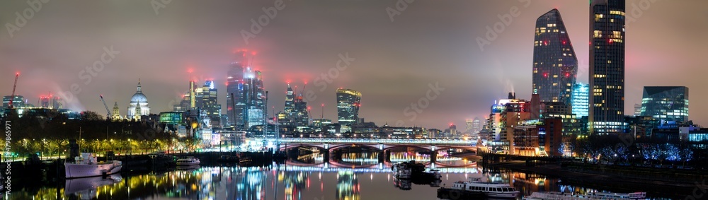 Skyline panorama Southbank of river Thames at night in London. England