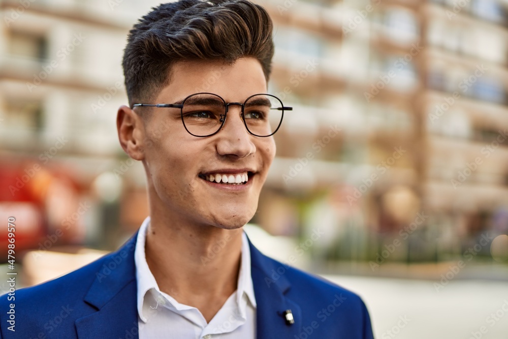 Young man smiling confident wearing suit and glasses at street Young man smiling confident wearing suit and glasses at street