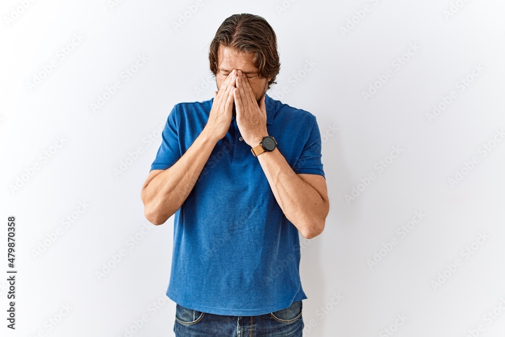 Handsome middle age man standing together over isolated background rubbing eyes for fatigue and headache, sleepy and tired expression. vision problem Handsome middle age man standing together over isolated background rubbing eyes for fatigue and headache, sleepy and tired expression. vision problem