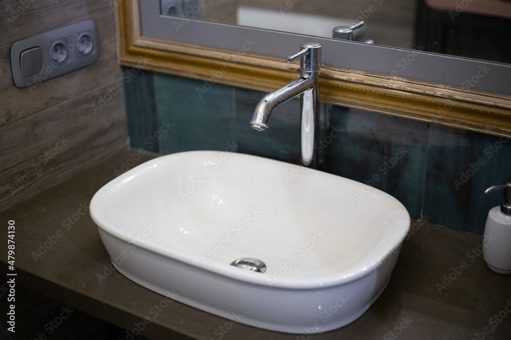 Washbasin with a sink in a modern bathroom Washbasin with a sink in a modern bathroom