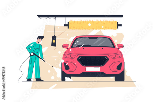 Man washing red vehicle with foam and water