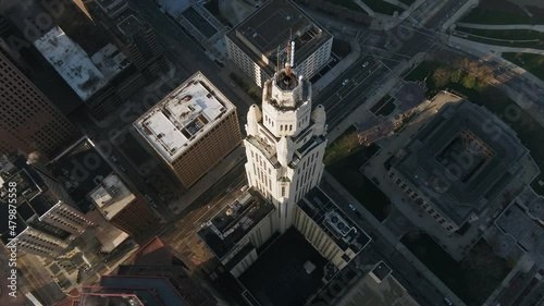 Aerial view overlooking the Leveque Tower, in sunny Columbus - descending, drone shot photo