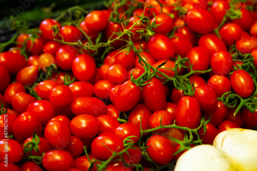 Fresh red Cherry tomatoes, put up for sale at the market