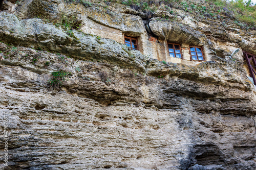 Rocky monastery with cells for monks. Background with copy space photo