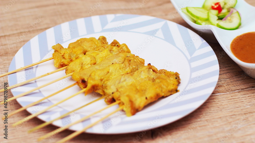 Pork satay,Grilled pork served with peanut sauce or sweet and sour sauce, Thai Street food. Pork satay,Grilled pork served with peanut sauce or sweet and sour sauce, Thai Street food.