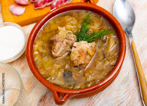 National dish of Russian cuisine is cabbage soup, cooked in thick broth and on the basis of sauerkraut with meat