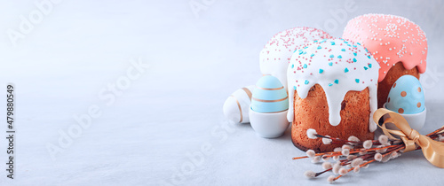 Easter egg and cake on grey table background.