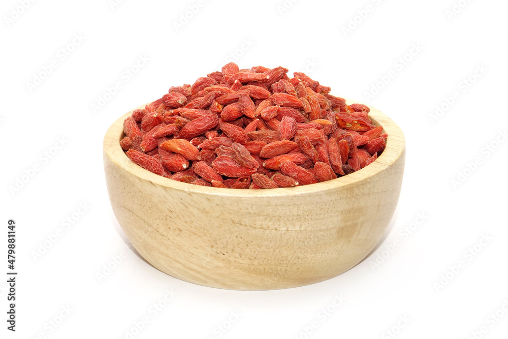 Goji berry in wooden bowl isolated on white background Goji berry in wooden bowl isolated on white background