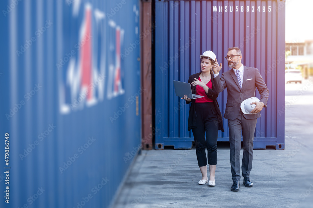 Business man working with women team or secretary in port cargo logistics industry - obrazy, fototapety, plakaty 