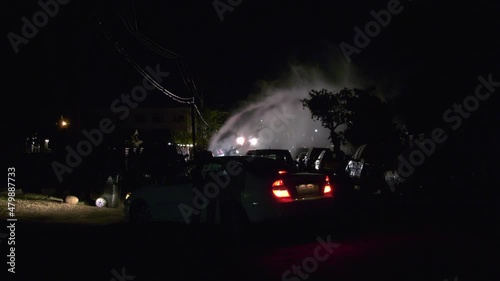 fire hydrant spraying water on street photo