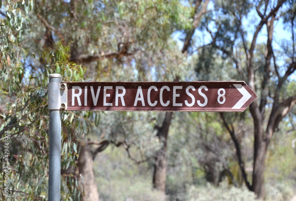 Road sign marker for Murray River access in the forest