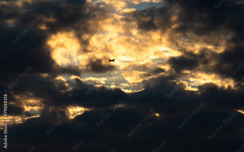 Air plane silhouette against dramatic sunrise sky. Photo taken with a plane that took of from Otopeni International Airport in Romania. Air plane silhouette against dramatic sunrise sky. Photo taken with a plane that took of from Otopeni International Airport in Romania.