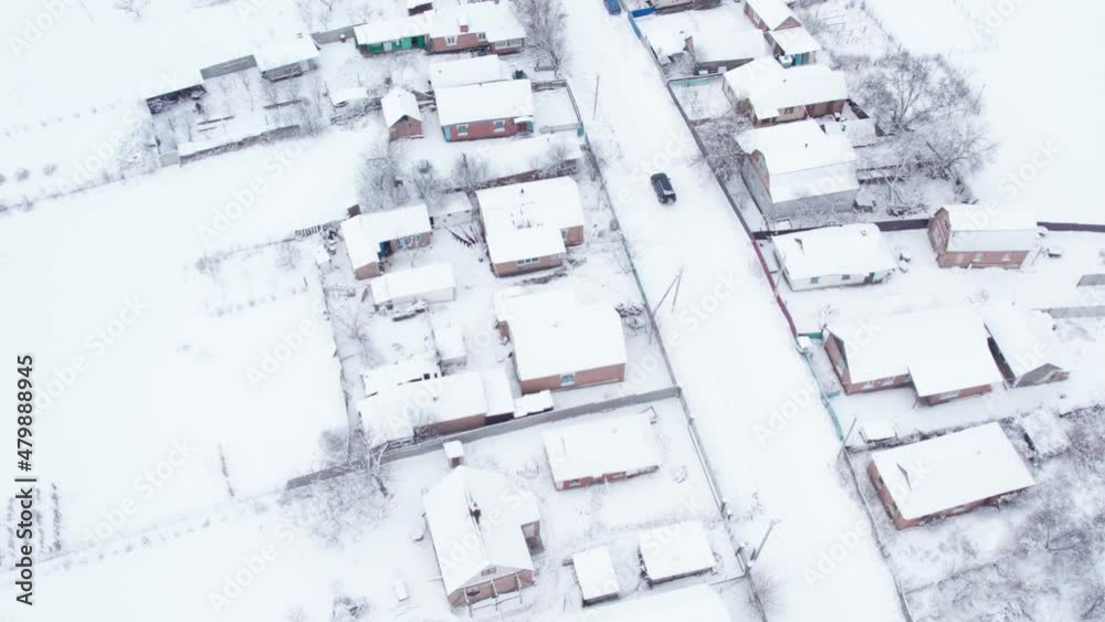 Aerial top down drone shot of Snowy village road and car on it. Forest road from above. White background. Diagonal highway. Minimalism concept 4k video Aerial top down drone shot of Snowy village road and car on it. Forest road from above. White background. Diagonal highway. Minimalism concept 4k video
