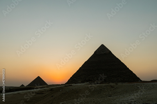 Gentle sunset over the Pyramids of Giza in Egypt
