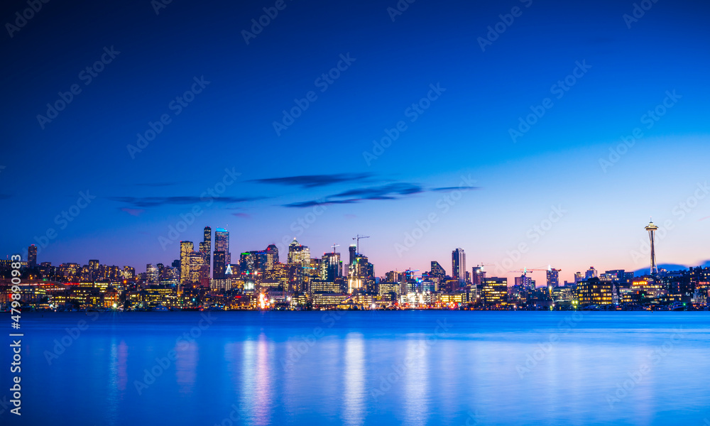 seattle city skyline at night with reflection in water. seattle,washington,usa.