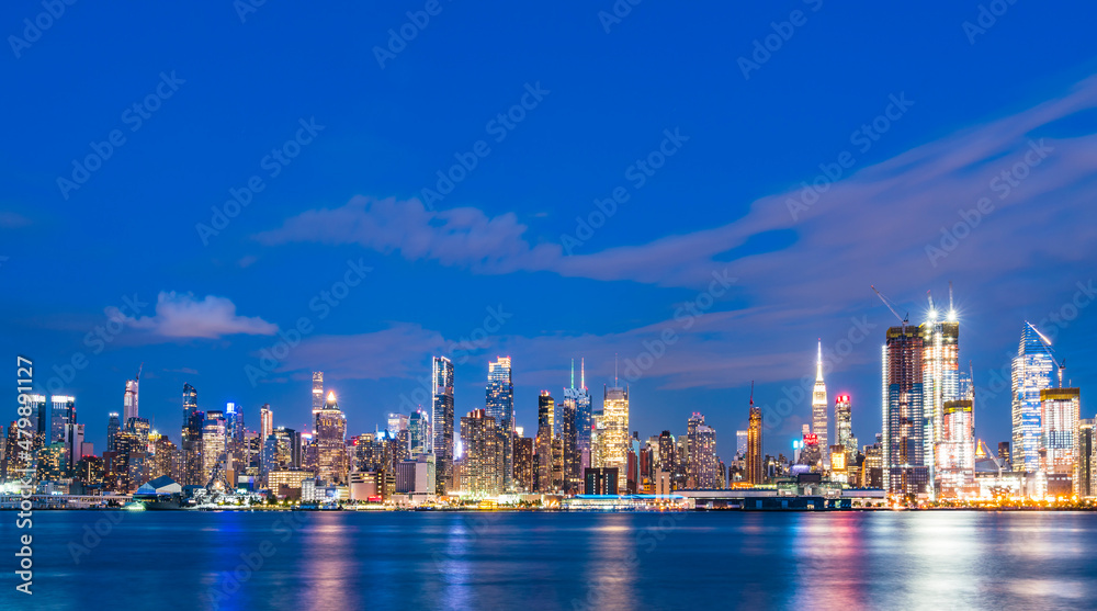 new york,usa, 08-25-17: new york city skyline  at night with reflection in hudson river.