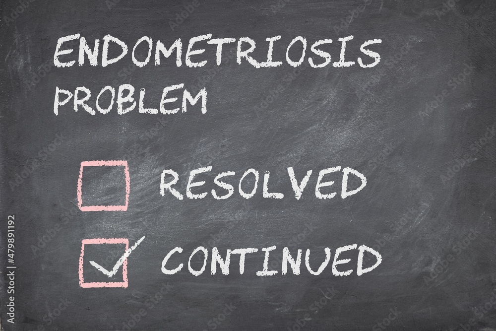Women's health issues concept. Endometriosis problem continued selected in check boxes. Blackboard background. Women's health issues concept. Endometriosis problem continued selected in check boxes. Blackboard background.