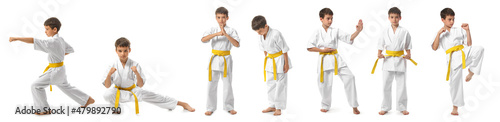 Little boy practicing karate on white background photo
