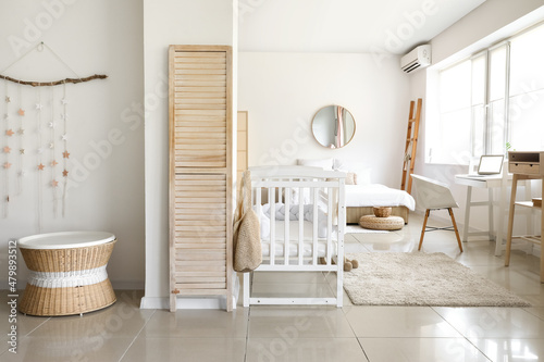 Interior of light bedroom w...