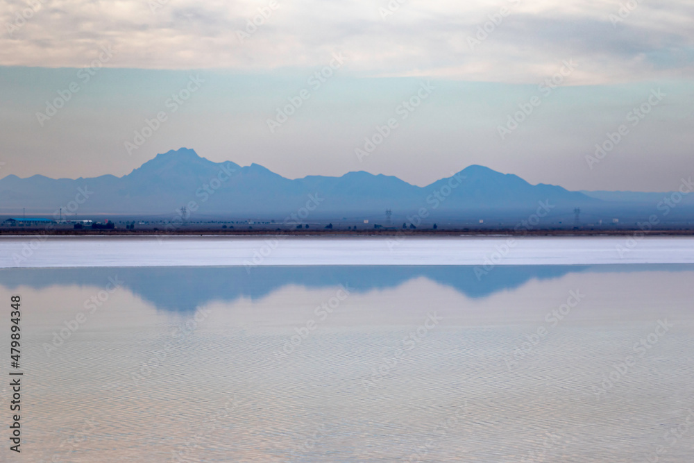 Sunset and azure mountains on the salt lake Sunset and azure mountains on the salt lake
