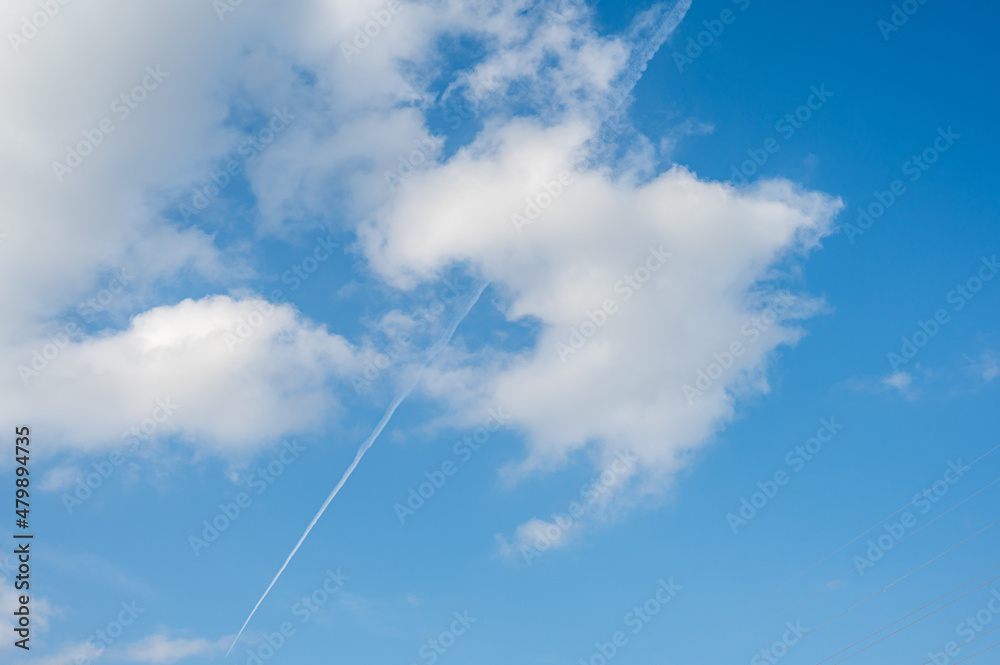 The plane's wake across the sky is like a cloud The plane's wake across the sky is like a cloud