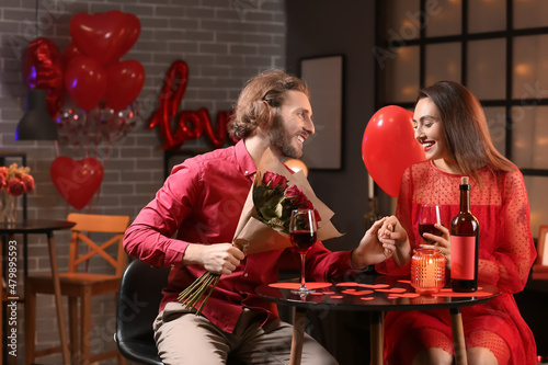 Happy young couple celebrat...