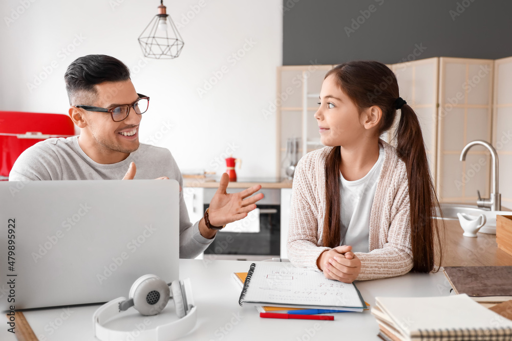 Little girl studying with tutor at home Little girl studying with tutor at home