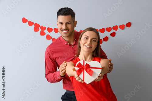 Happy young couple with gif...