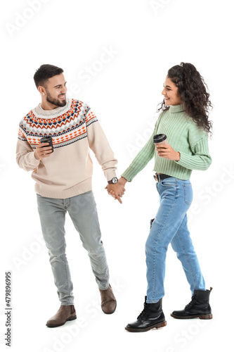 Happy young couple in warm ...