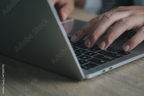 Businessman or student wearing white shirt using laptop for searching, working, online learning, marketing, studying, distance education network online technology.selective focus.