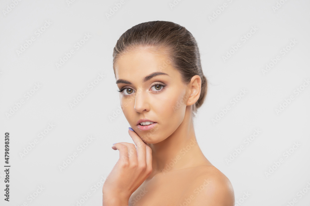 Beauty portrait of young, attractive and healthy woman. Beautiful brunette girl over white background. Natural female face. Beauty portrait of young, attractive and healthy woman. Beautiful brunette girl over white background. Natural female face.