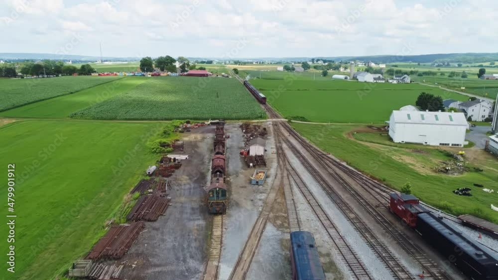 An Aerial View Chasing a Steam Passenger Train Traveling Thru Farm Lands An Aerial View Chasing a Steam Passenger Train Traveling Thru Farm Lands