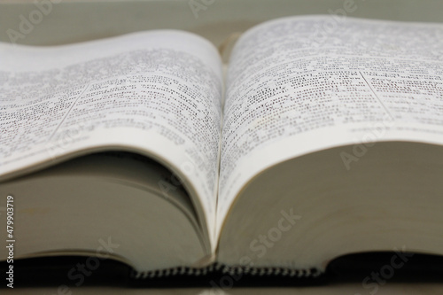 the book is an old thick stack of the bible