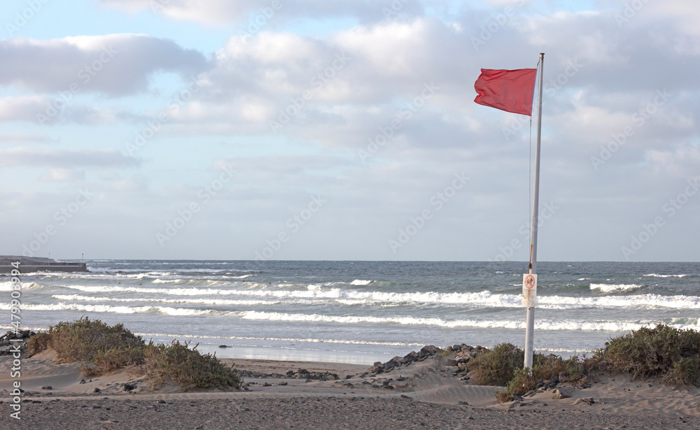 Red flag warning on beach in Spain