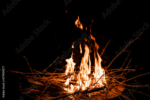 fire and flames. Flames and burning sparks close up, fire patterns. flames from the fire. Night bonfire, logs are on fire, sparks fly. soft focus.shallow focus effect..