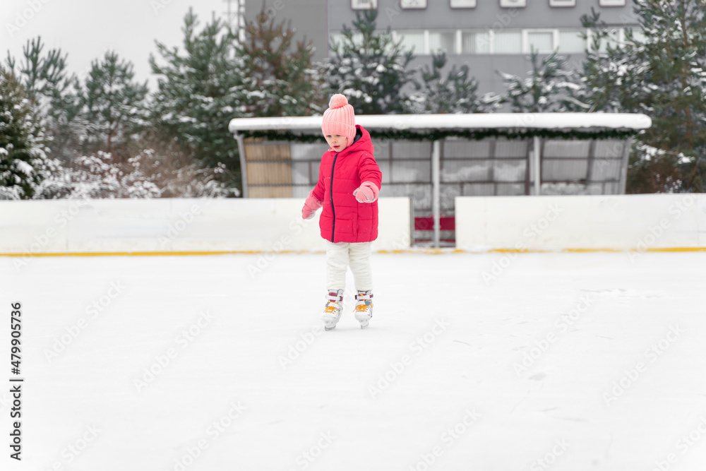 happy child at winter outdoor ice rink happy child at winter outdoor ice rink