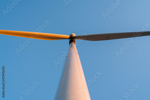 Wind power generator with blue sky background. 노을빛이 물든 풍력발전기, 풍력, 터빈, 블레이드, 신재생에너지, 친환경