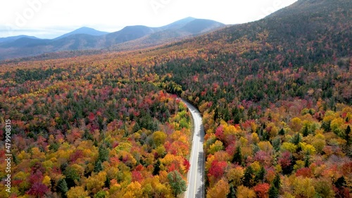Aerial View of road through mountains with autumn changing leaves photo