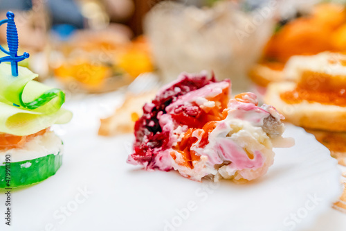 Traditional Russian salad with beetroot and salted herring for the New Year