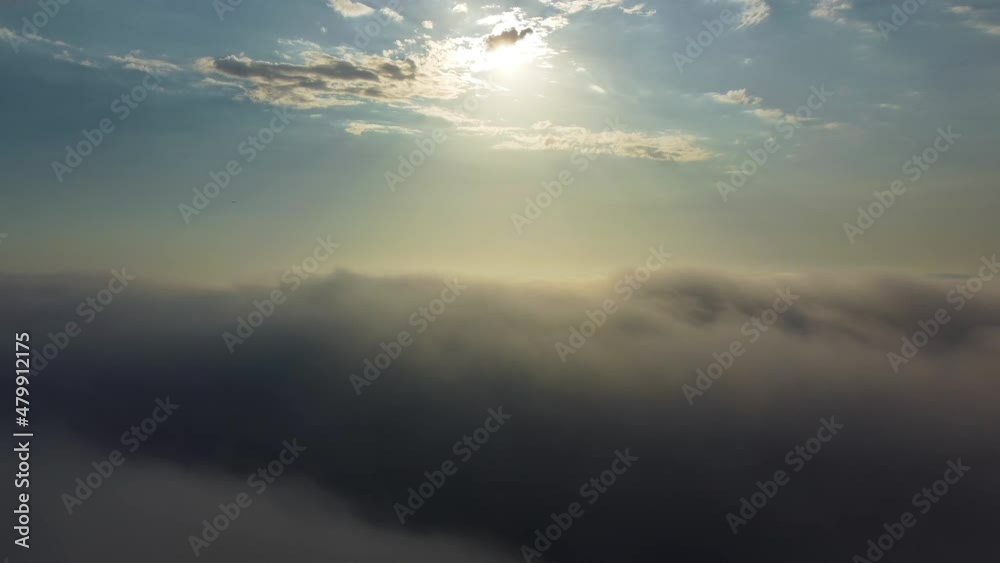 drone view flying over the clouds. a dreamy, peaceful cloudscape. drone view flying over the clouds. a dreamy, peaceful cloudscape.