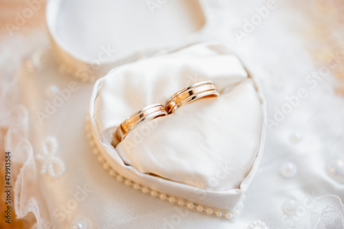 wedding gold rings on the table closeup photo