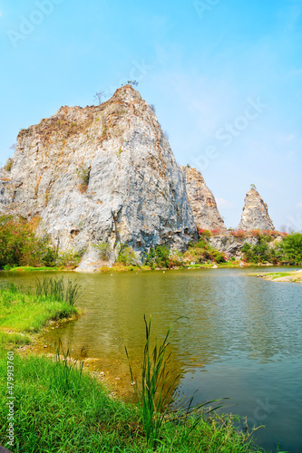 nature landscape of Khao Ngoo Rock Park with blue sky in sunshine day, famous place in Ratchaburi, Thailand.