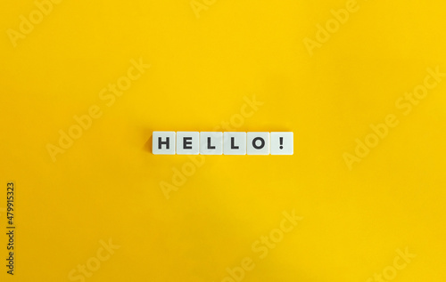 Hello Word and Banner. Letter tiles on bright orange background. Minimal aesthetics. photo