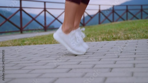 Wallpaper Mural woman is skipping rope in morning workout, closeup of feet in sporty sneakers Torontodigital.ca