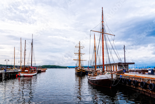 Old Wooden Sailing Ships Moored in the harbour of Oslo photo