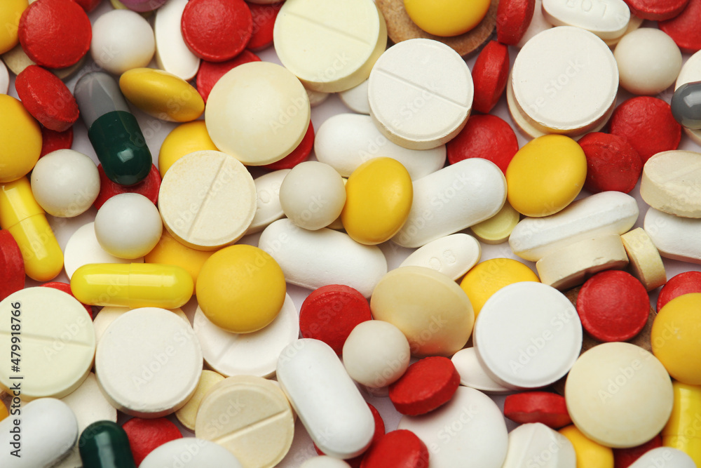 Different colorful tablets at white background